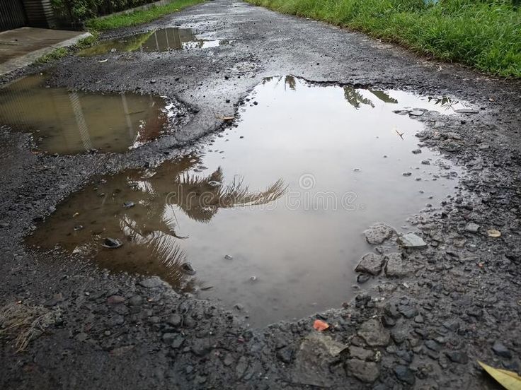 Damaged Asphalt Road with Potholes Inundated with Water Stock Photo - Image of water, waterway_ 253536180