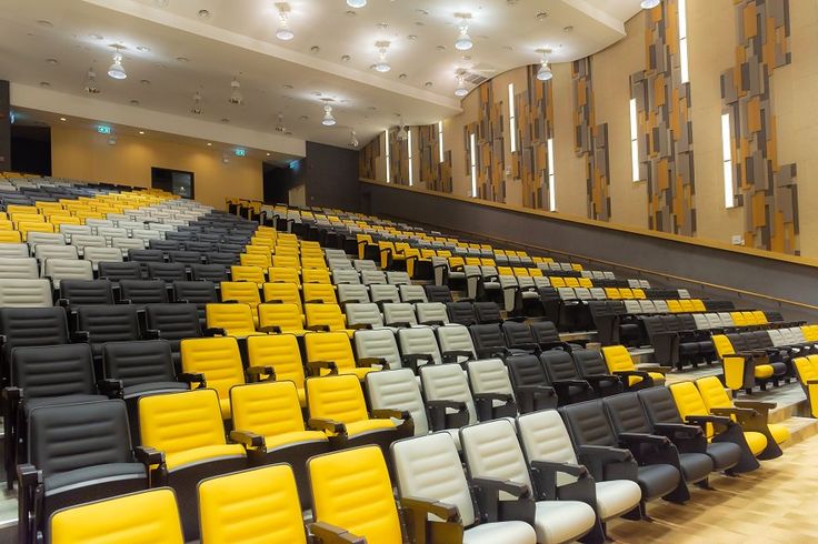 Close Up row of modern designed indoor seats in the theater_, Modern interior of school assembly hall_