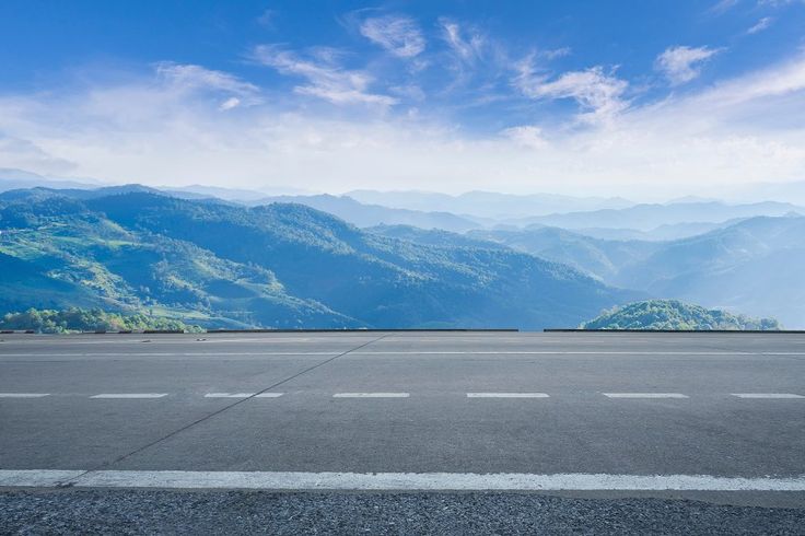 Empty highway asphalt road and beautiful sky mountain landscape